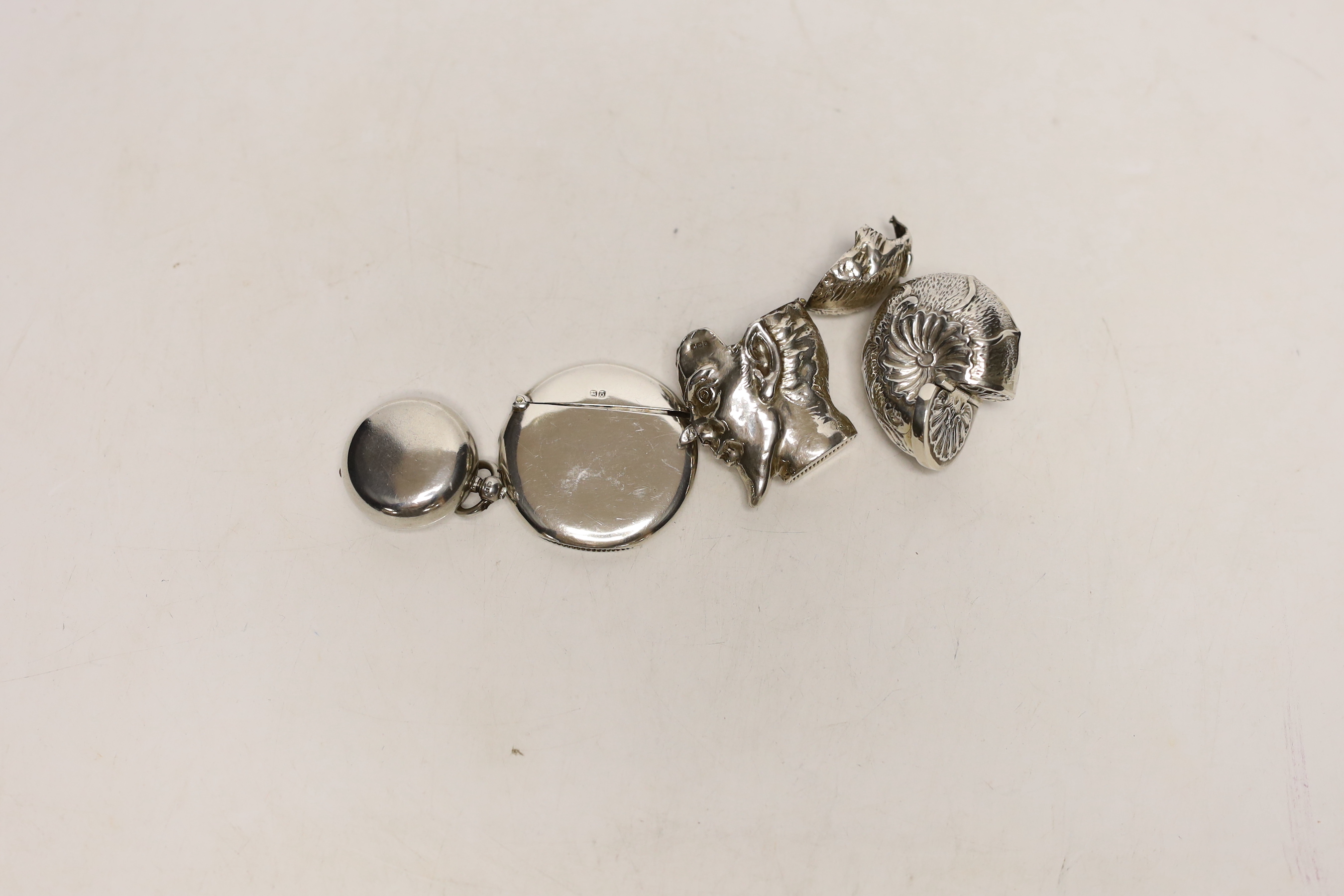 A late Victorian silver sovereign case, London, 1892, 30mm, a silver circular vesta, a white metal faun vesta and a shell box.